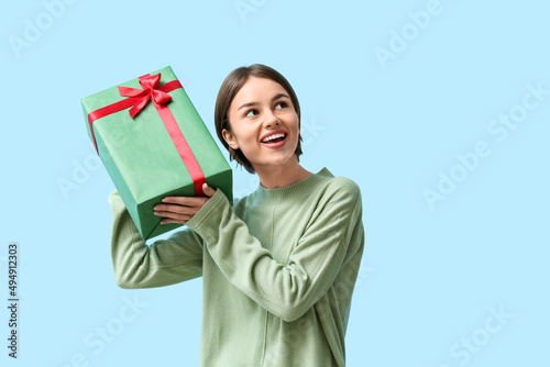 Beautiful woman holding gif...