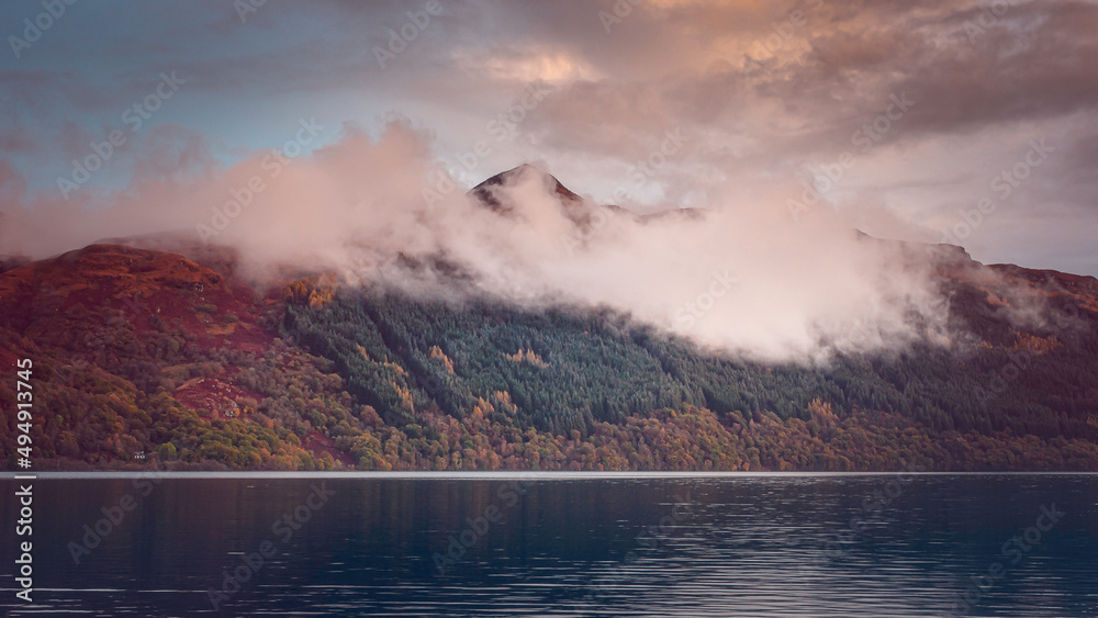 Autumn colours around Loch Lomond. Beautiful landscape scenery in Scotland. Film camera effect.