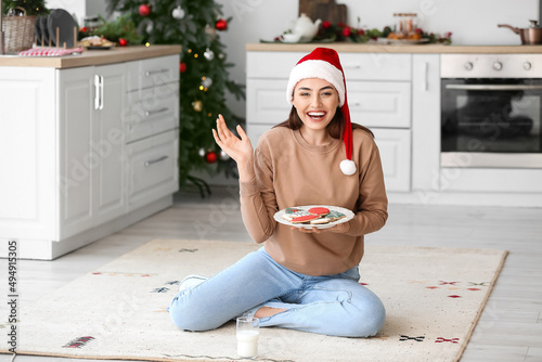 Happy young woman in Santa ...