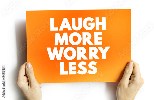 фотография Laugh More Worry Less text quote on card, concept background