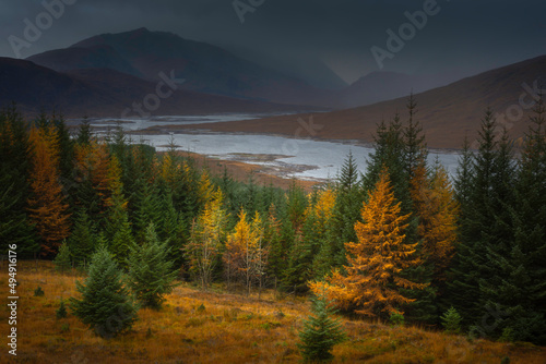 Majestic landscape of Scotland. A dark and moody sky over Loch Loyne in autumn. Beautiful scenery in Scottish Highlands.