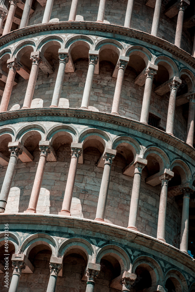 Texture fragment of the famous sloping tower with columns in Pisa, Italy. fascinating exotic amazing places.