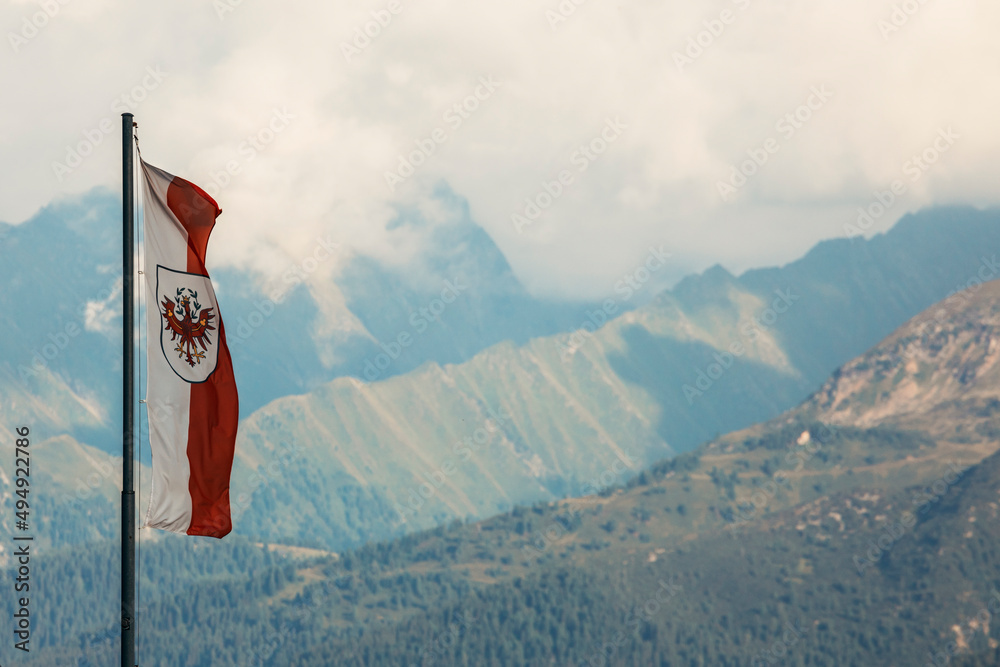 flag of tirol in the mountain landscape - obrazy, fototapety, plakaty 