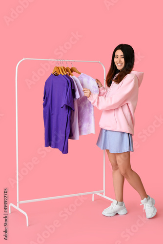 Young Asian woman and rack ...