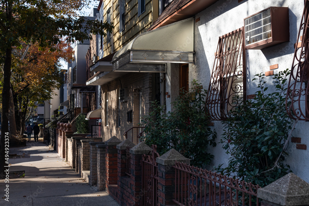 Row of Old Homes and Residential Buildings along a Sidewalk in Williamsburg Brooklyn