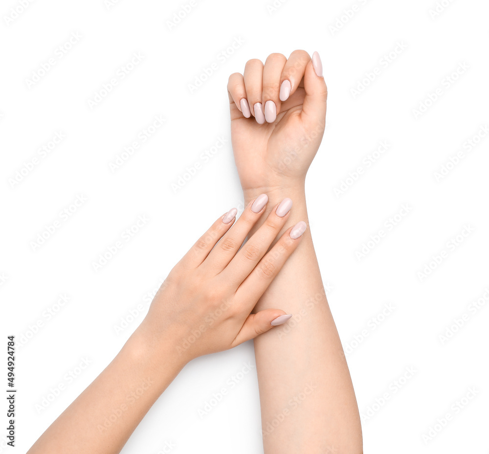 Female hands with stylish gentle manicure on white background Female hands with stylish gentle manicure on white background