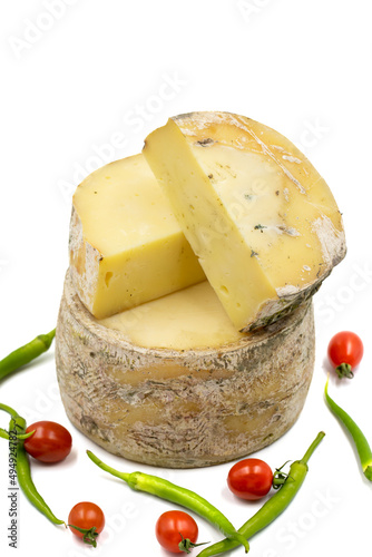 Fototapeta Naklejka Na Ścianę i Meble -  Goat cheddar cheese isolated on a white background. close up