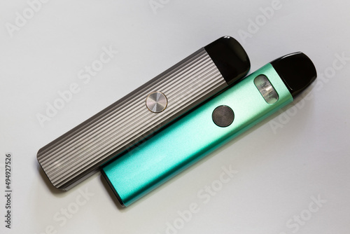 New system electronic cigarettes. Vape pod system or pod mod. Small and lightweight nicotine vapor sticks with replaceable cartridges. photo