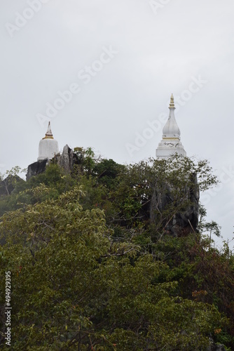 A temple's pagoda in northern Thailand, erected on top of a steep mountain.