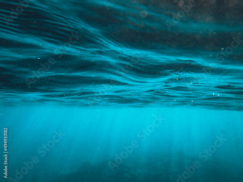 Canvas Print View of the bottom of the sea or ocean with sunlight penetrating from the above