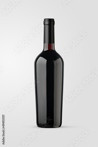 A bottle of red wine isolated on a neutral background for mockup presentation projects.