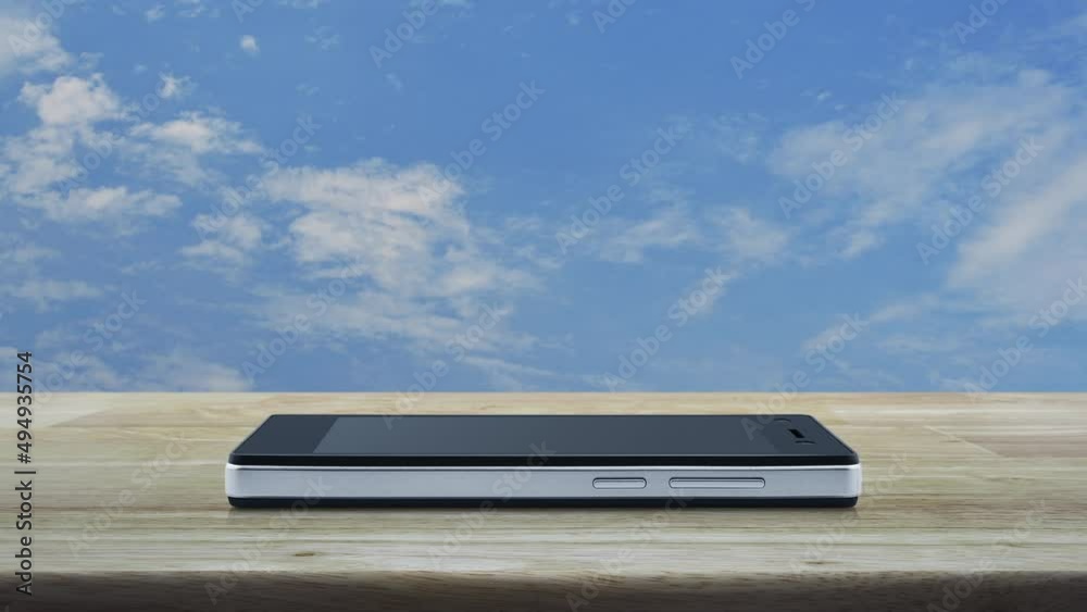 Padlock flat icon on modern smart mobile phone screen on wooden table over blue sky with white clouds, Technology internet security and safety online concept Padlock flat icon on modern smart mobile phone screen on wooden table over blue sky with white clouds, Technology internet security and safety online concept