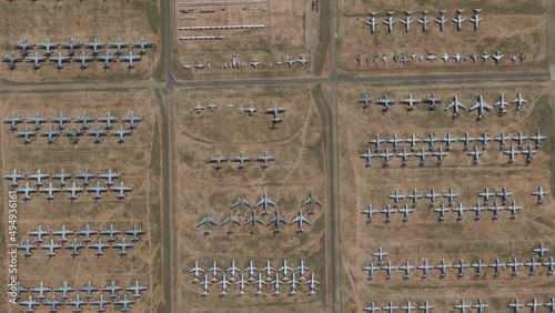 Aerial top down view of aircraft boneyard or graveyard is storage area for airplanes that are retired from service they are generally located in deserts for example in Tucson USA 4k high res animation photo