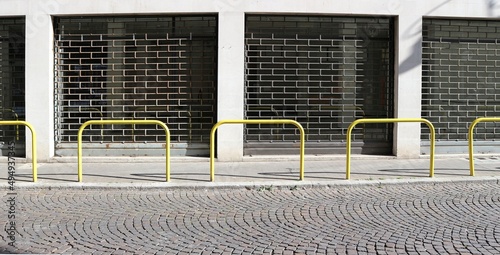 Bild auf Leinwand Closed shop with the folding security gates down