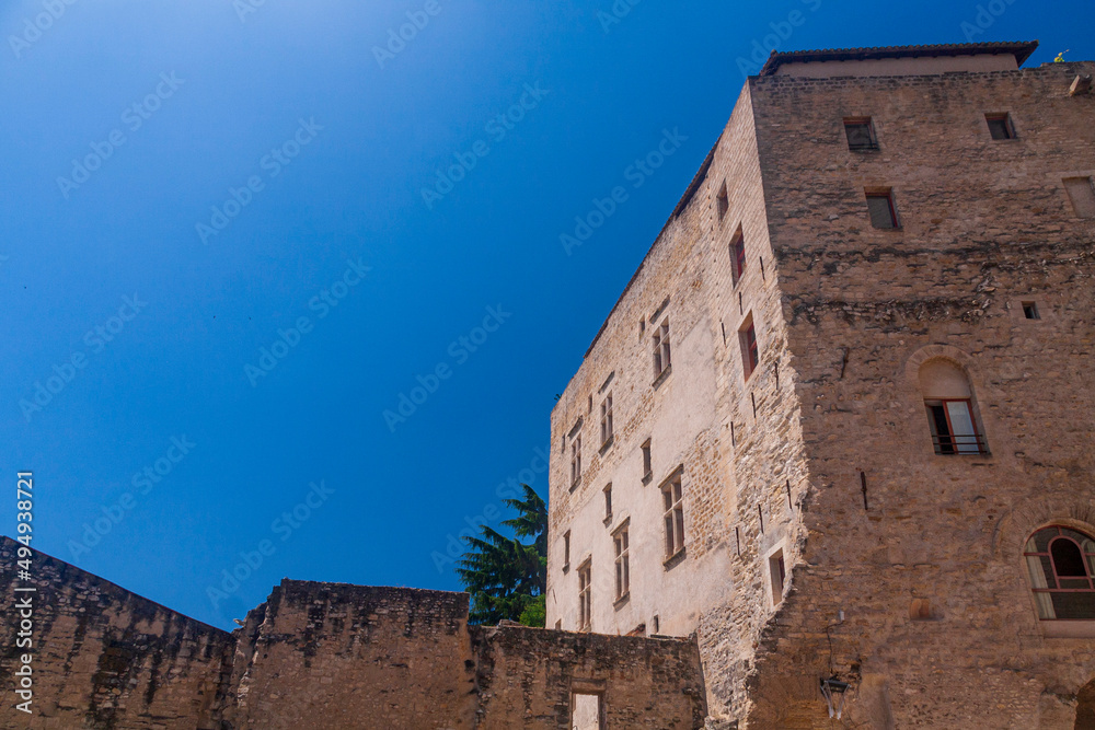 Ruin of a old castle in a village in Provence Avignon under a blue sky in a sunny day