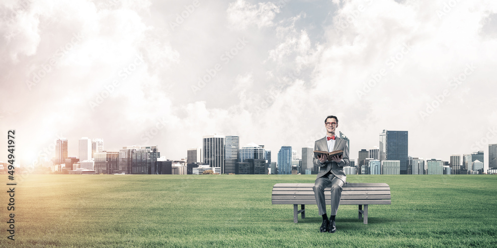 Young businessman or student studying the science and cityscape at background Young businessman or student studying the science and cityscape at background