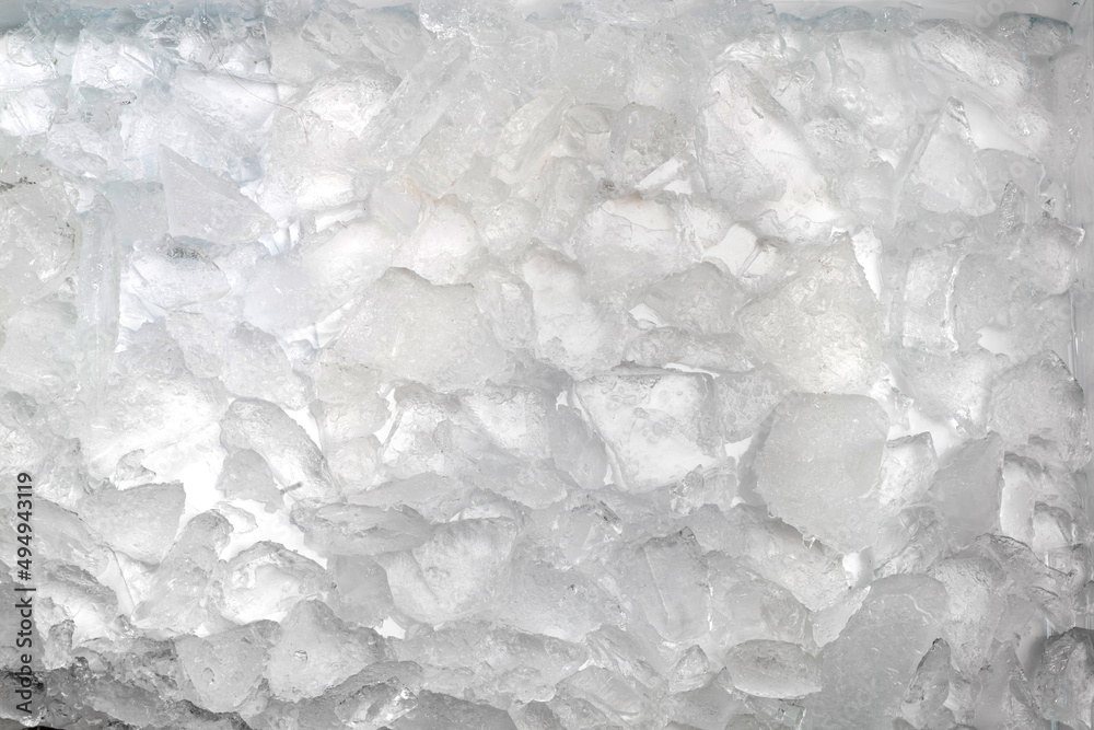 Abstract ice texture. Icy chunks on the surface. Top view close up. Fragments of crystals of irregular shape Abstract ice texture. Icy chunks on the surface. Top view close up. Fragments of crystals of irregular shape