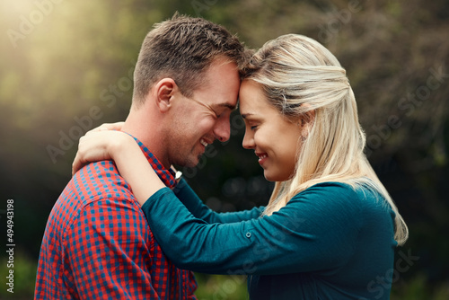 They found happiness in each other. Shot of an affectionate young couple spending quality time together outdoors.