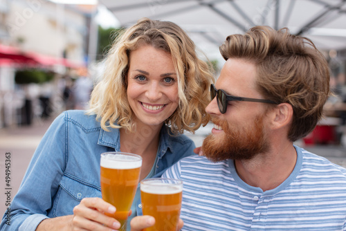 happy friends having beers on a sunny day