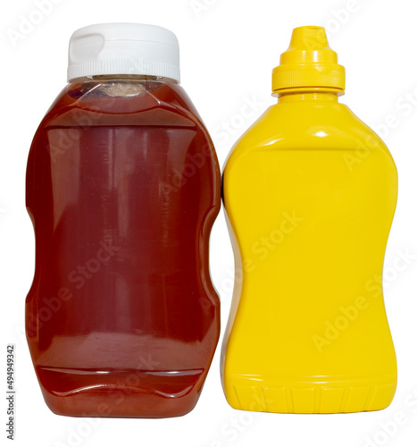 Isolated bottles of ketchup and mustard.