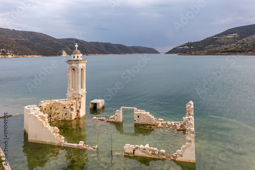 Ruined old church in Alassa, Cyprus is submerged under water of Kouris dam, photographed from drone photo