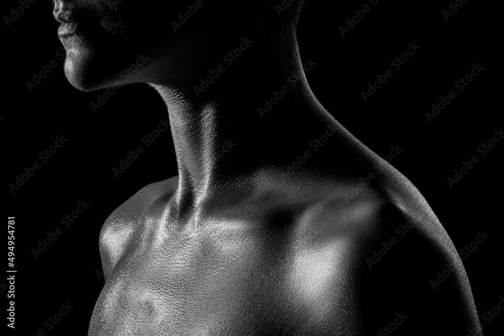Black and white image of a beautiful female body. Studio shooting with