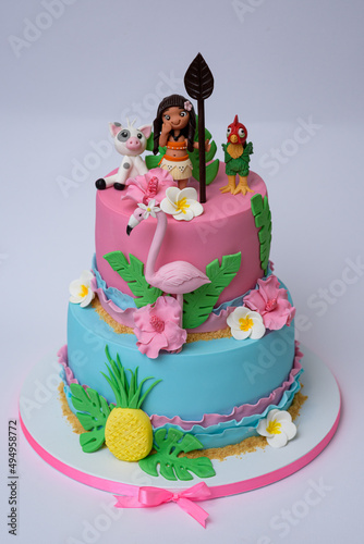 Vertical photo of Moana and flamingo theme layer cake