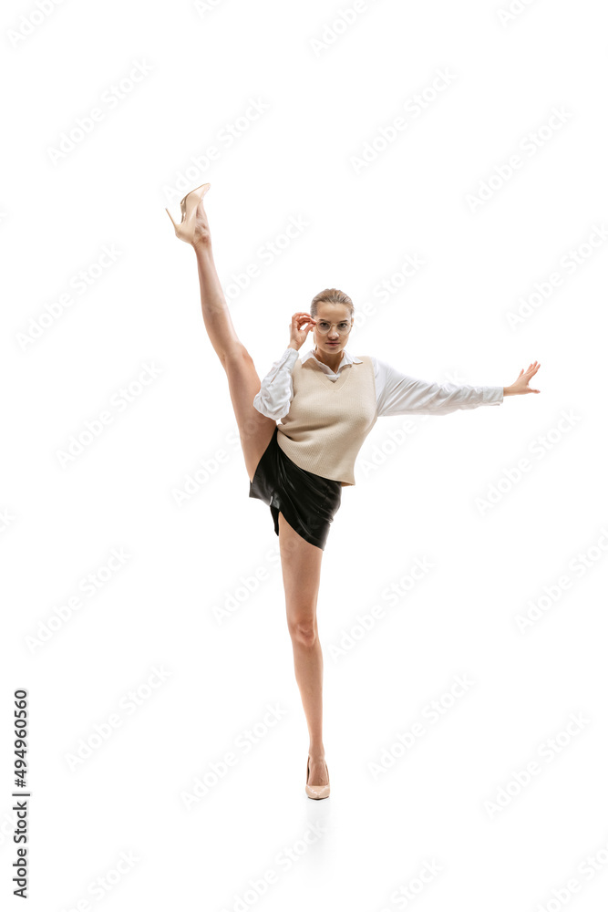 Portrait of young beautiful girl, business woman in stylish official cloth isolated over white studio background