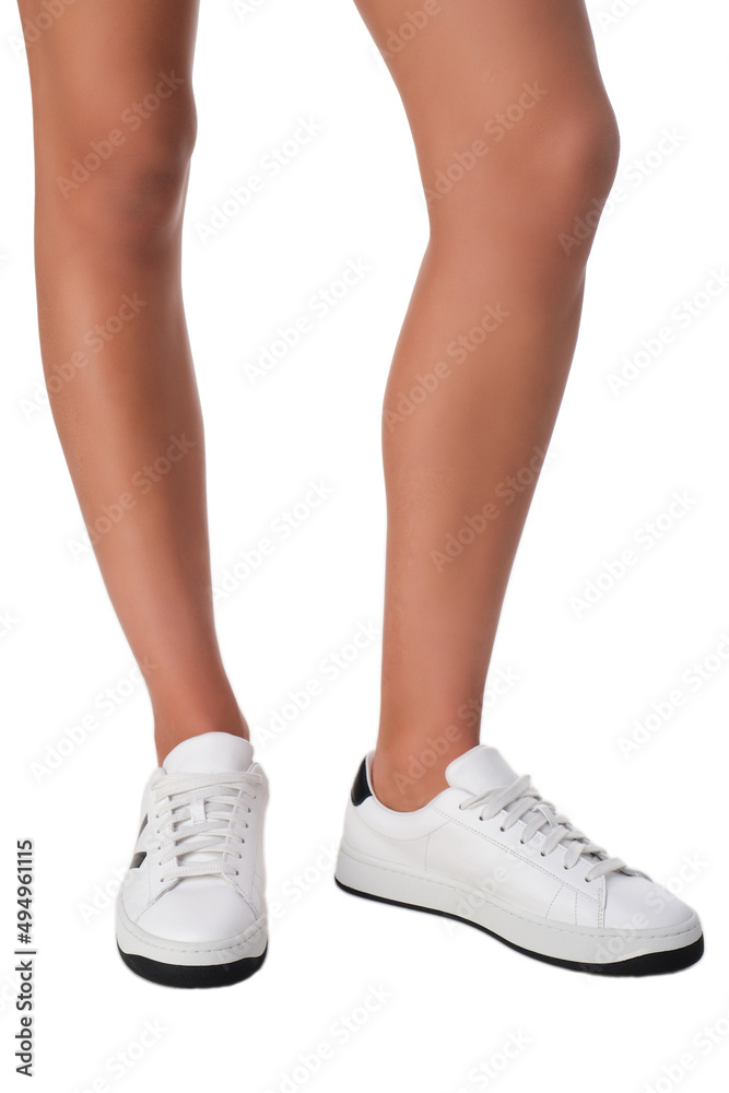 women shoes on legs on a white background women shoes on legs on a white background