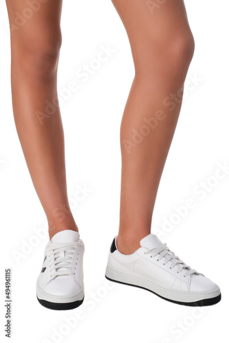 women shoes on legs on a white background © scaffer