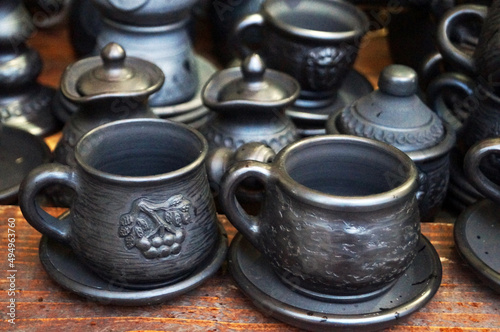 Ukrainian ceramic dishes made of black and brown clay for the fair