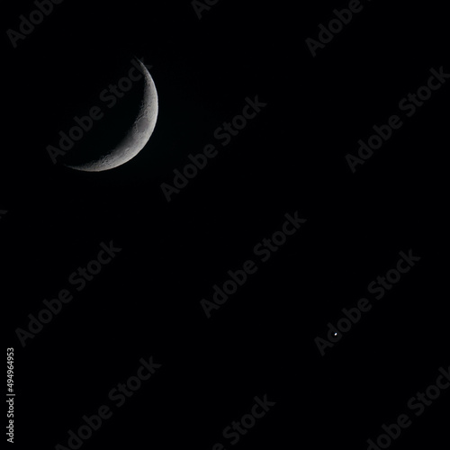 Canvas Print Beautiful closeup view of a crescent moon and a star during the night