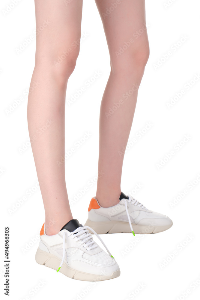 women shoes on legs on a white background women shoes on legs on a white background