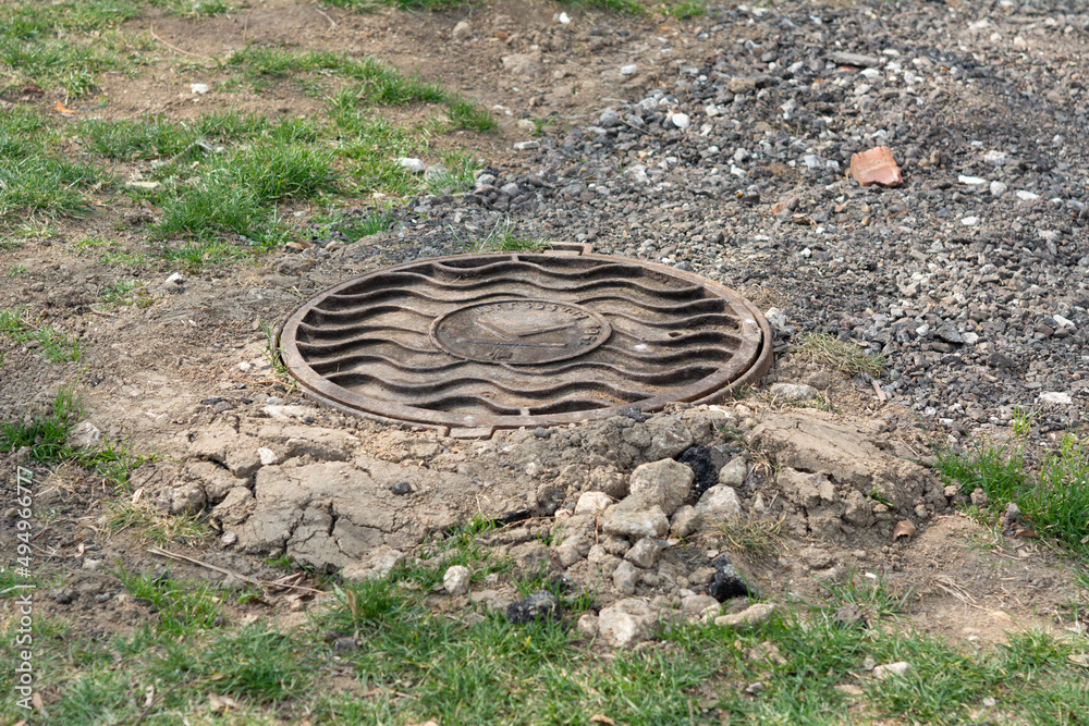 Obraz na płótnie Tiraspol, Moldova - March 25, 2022 Sewage manhole cover with serial number of local company. w salonie