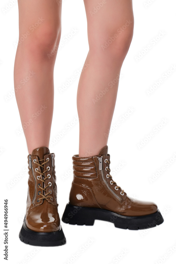 women shoes on legs on a white background women shoes on legs on a white background