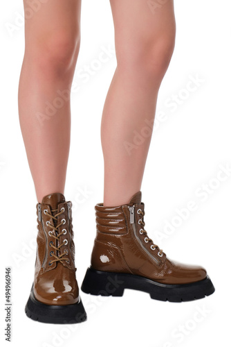 women shoes on legs on a white background © scaffer