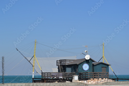 We are located in Cesenatico, an Italian town in Romagna, on the coast of the Adriatic Sea. Details of the quay of the canal port. photo