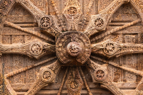 Closeup Detail of a stone wheel of chariot at Sun Temple, Konark, Orissa, India photo