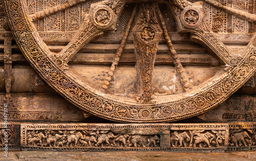 Closeup Detail of a stone wheel of chariot at Sun Temple, Konark, Orissa, India photo