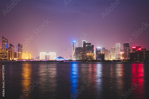 Hangzhou Qianjiang New Town urban business center is reflected on the river © H stock