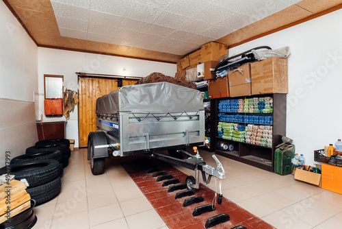 car garage with car trailer