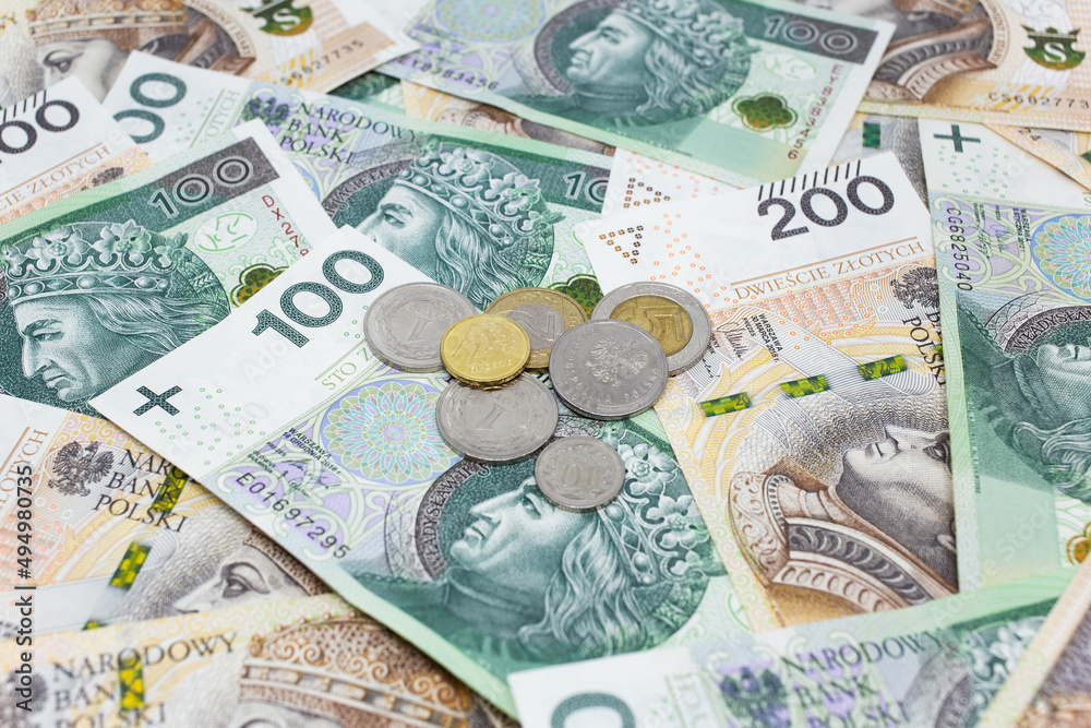 Zloty - Polish banknote. Polish currency on a white background arranged in a pattern. Illustrates cash flow and business Zloty - Polish banknote. Polish currency on a white background arranged in a pattern. Illustrates cash flow and business