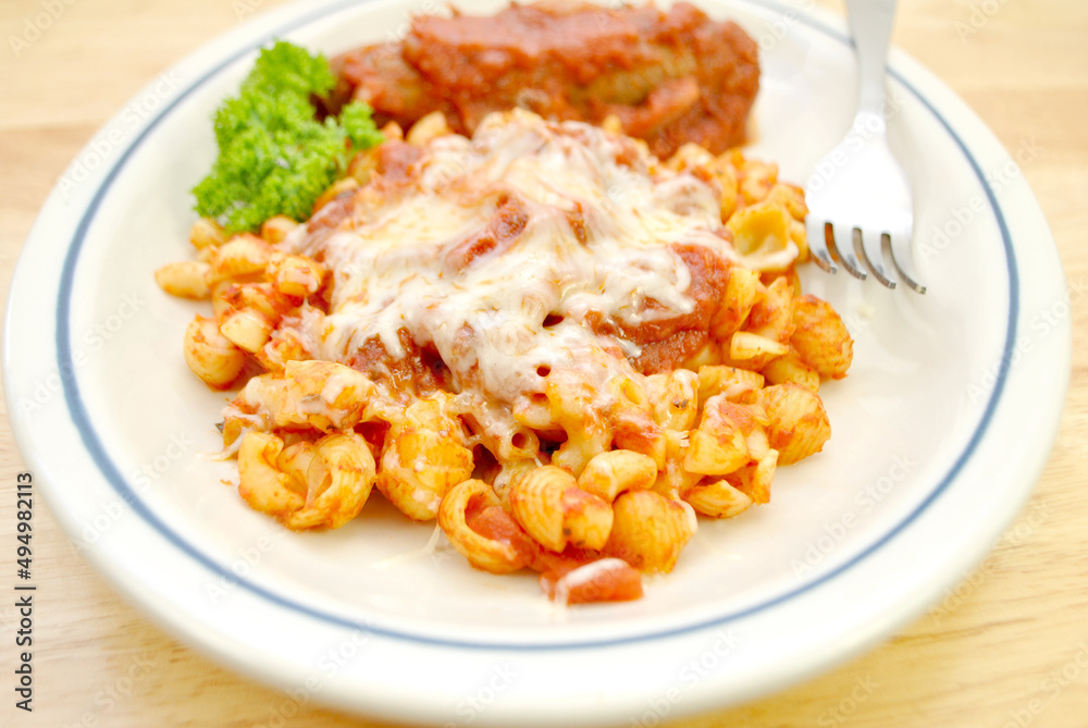 Shell and Elbow Pasta with Sauce and Cheese and a Sausage on the Side Shell and Elbow Pasta with Sauce and Cheese and a Sausage on the Side