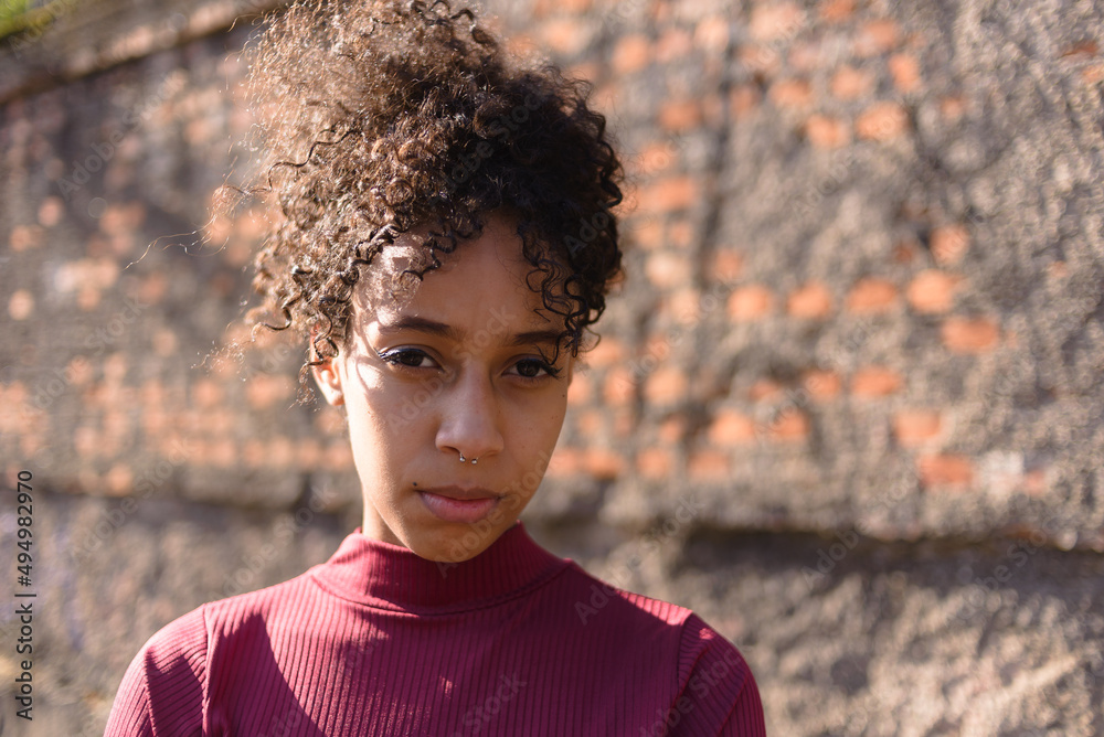 Black young woman portrait outdoors in urban landscape Black young woman portrait outdoors in urban landscape
