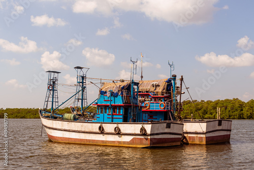 Marina Landscape at Old Goa jetty where fishing boats, trawlers and luxury yachts are anchored. 
