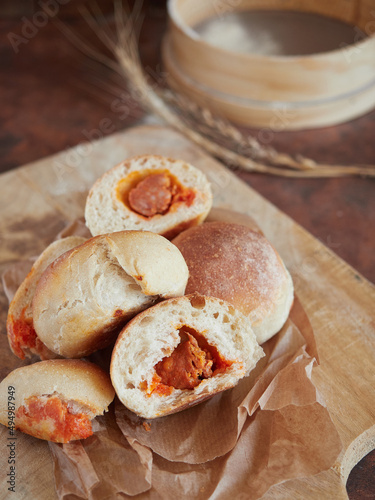 several scrumptious bread buns stuffed with chorizo. A typical traditional spanish food from the north region (Asturias). They are called "bollos preñados" which means pregnant buns.