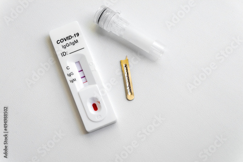 Test kit for viral disease COVID-19 2019-nCoV (coronavirus). Quick blood test shows a positive result for antigens for SARS-CoV-2 virus