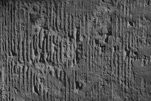 gray background, in the photo, gray concrete wall close-up.