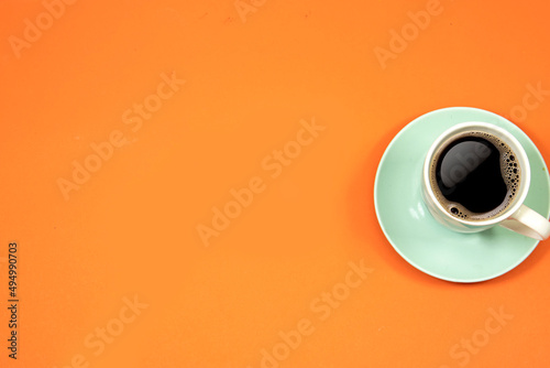 cup of coffee isolated on orange background. hello Monday concept , back to work 
