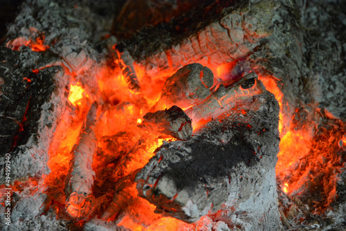 smoldering wood fire in the fireplace